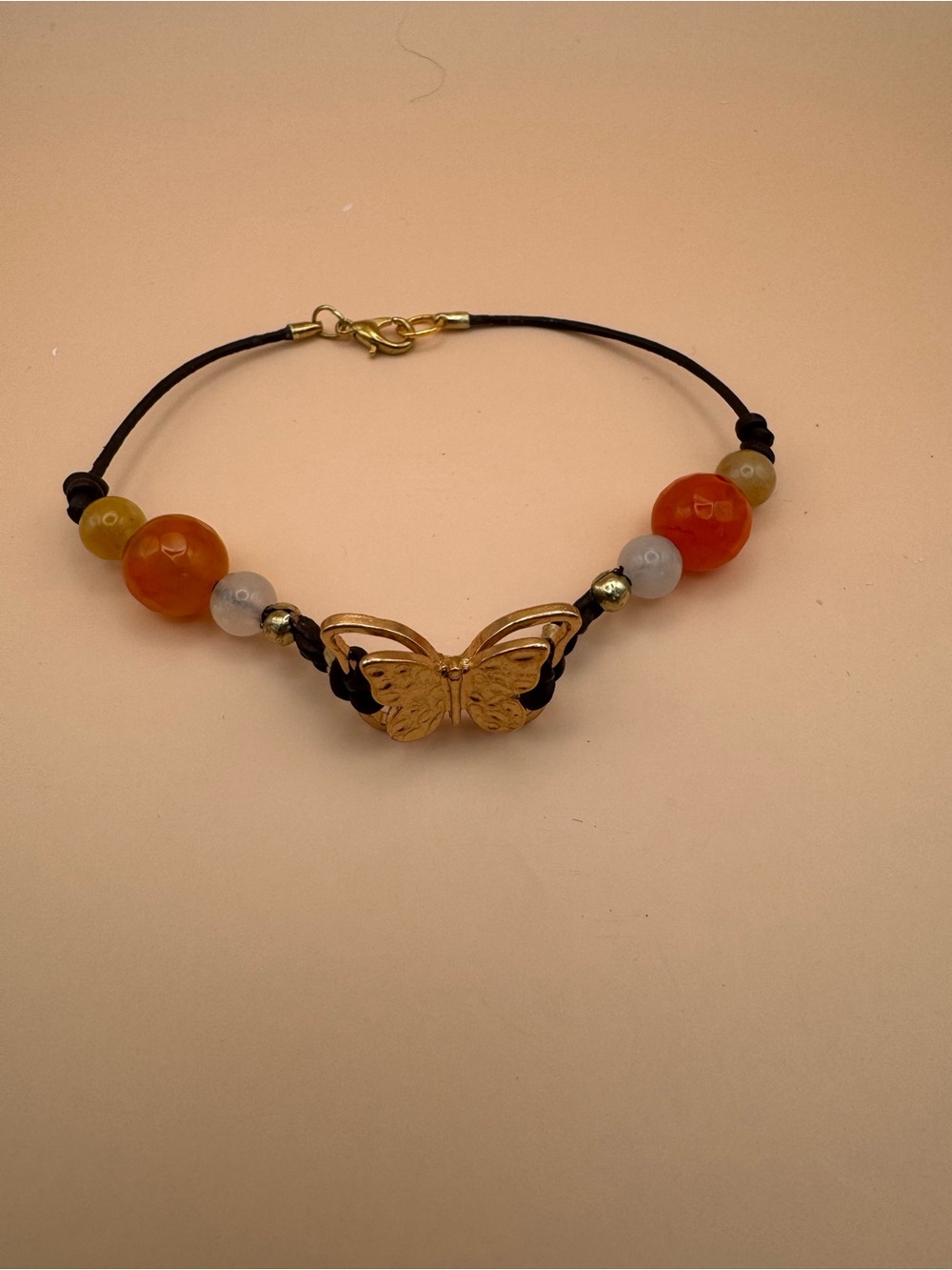 Gold Butterfly Bead Cord Bracelet in Orange and Cream